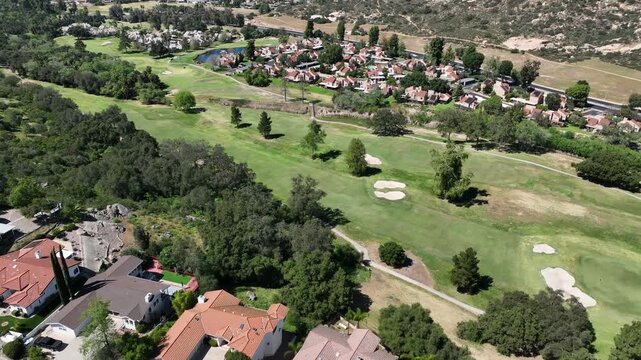 Aerial view of Ramona neighborhood with mountain, valley and San Vicente Golf Course, in California, USA