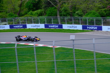 Obraz premium May 24, 2025, Montreal, Canada: Red Bull Racing Formula 1 car during by Hadjar or Verstappen, demonstration run at Circuit Gilles Villeneuve. g.