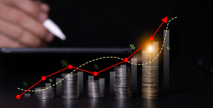 The concept of business, financial, and investment data analysis: Business people analyze financial data using economic growth charts and graphs, business strategies, planning, and market research.