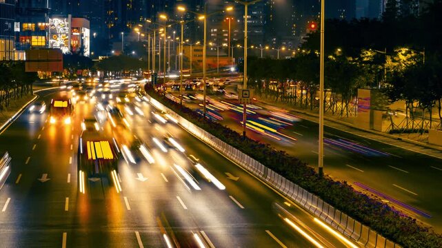 Night traffic light trails on busy urban boulevard
