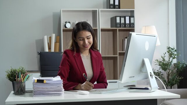 Young Asian woman in suit works confidently in office as business consultant, providing strategic advice, analyzing market trends, financial stability for corporate clients and organizations.