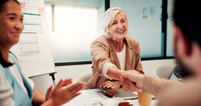 Meeting, shaking hands and people with applause, success and celebration for investment approval. Manager, partnership and handshake for accountant agreement, congratulations and b2b achievement