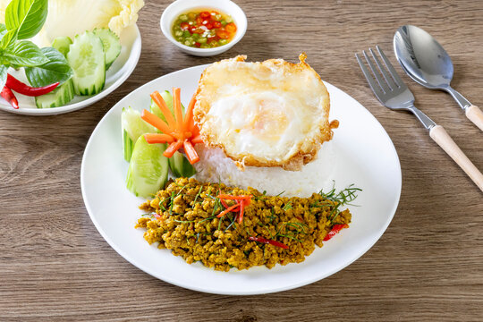 Rice topped with Southern-style yellow curry pork and a fried egg.