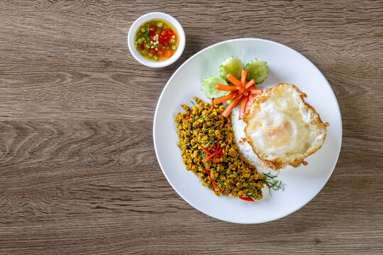 Rice topped with Southern-style yellow curry pork and a fried egg.