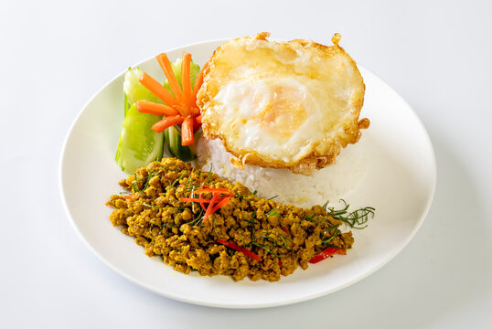 Rice topped with Southern-style yellow curry pork and a fried egg.