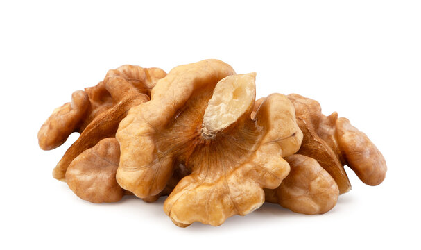 Pile of peeled walnuts close-up on a white background. Isolated