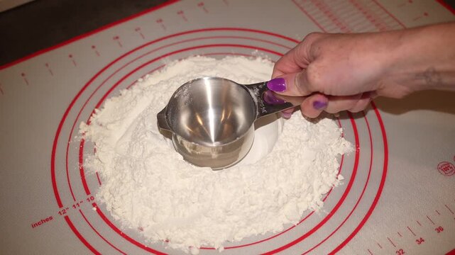making a well in white flour to make dough when baking
