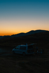 Naklejka premium Grand panoramic view from Prutas peak at night with sky, overlooking the dramatic limestone ridges and deep valleys of Durmitor National Park, Montenegro.