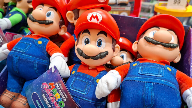 Mario plush toys soft dolls stacked together on shelves inside a retail toy store on May 11, 2026 in Bangkok, Thailand.