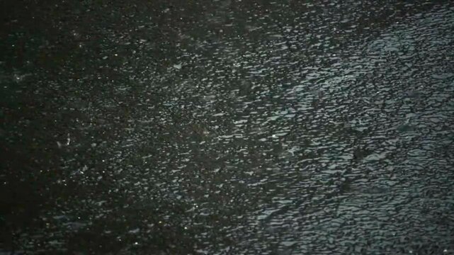 Breathtaking Organic Texture of Glistening Fluid Droplets and Pristine Moving Liquids of Water Drops on a Black Background in 4K Detailed Scene