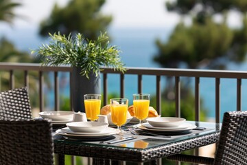 Fototapeta premium Breakfast on balcony with ocean view morning vacation travel resort hotel sea