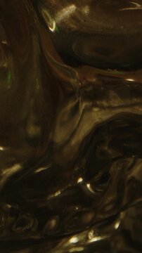 Vertical Eerie macro tilt up of a glass skull at the altar with a burning candle used for witchcraft