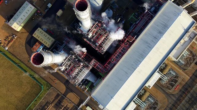 Top down aerial view showcasing the intricate pipeline infrastructure and mechanical layout of a power plant