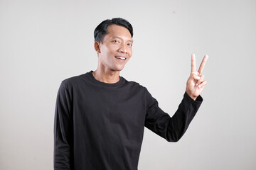 Fototapeta premium Man Showing Different Hand Gestures Isolated on Gray Background, Presentation and Communication Concept
