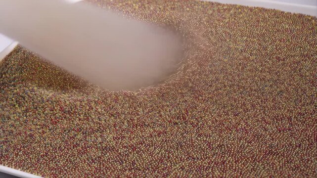 Air Stream of Compressed Particles Blasting Through a Nozzle, Creating Dense Spray Pattern in Motion Against Dark Background