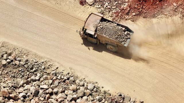 Limestone quarry operations with heavy machinery in aggregate processing and transport systems
