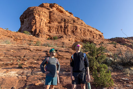Two male friends hiking in red rock country