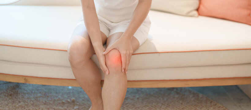 woman having knee ache and muscle pain due to Runners Knee or Patellofemoral Pain Syndrome, osteoarthritis, arthritis, rheumatism and Patellar Tendinitis. health and medical concept