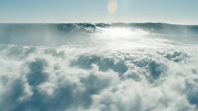 Powerful ocean wave cresting and breaking with white spray against a clear blue sky, oceanography, marine power