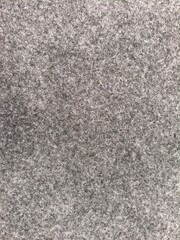 Fototapeta premium a close-up photo of gray concrete texture patterned on plain wall on March, 2026.