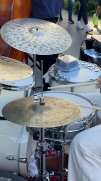close up of musician playing drums outdoors busking street performer
