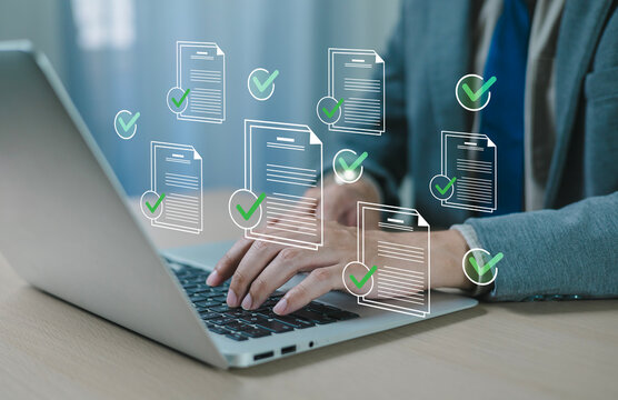 Business professionals use laptop computers to manage tasks and monitor work processes, including approval and processing. Automated request submission process; checkmark icon.