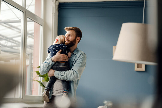Father spending time with his son at home