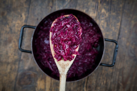 Wooden spoon of boiled red cabbage