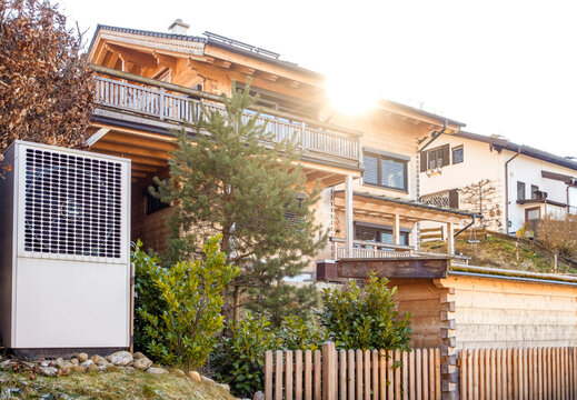 Germany, Bavaria, Modern heat pump in front of residential building