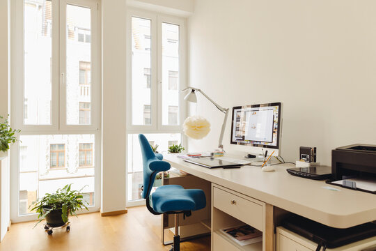 Home office with computer desk in modern building