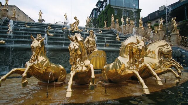 Golden sculptures in a majestic fountain at a ba na hills theme park in da nang