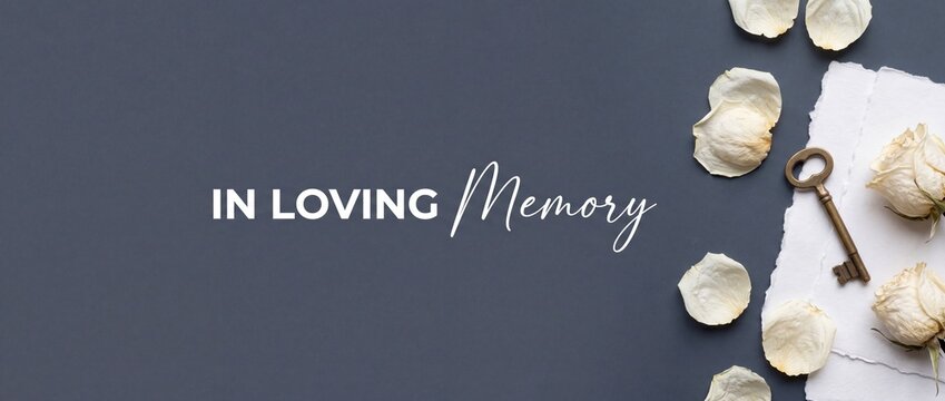 In loving memory memorial background with dried white roses and antique key flat lay banner on elegant dark gray charcoal card surface for peaceful mourning sympathy message condolence template