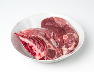 Obraz premium Raw lamb rack isolated, fresh mutton fillet with ribs, tenderloin pieces, mutton rump sirloin meat
