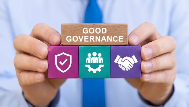 Businessman holding wooden blocks with good governance text and corporate icons representing ethical management compliance and business partnership