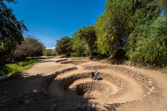 Ancient pre-Inca Cantalloc aqueducts spiral stone wells in the Nazca desert, Peru