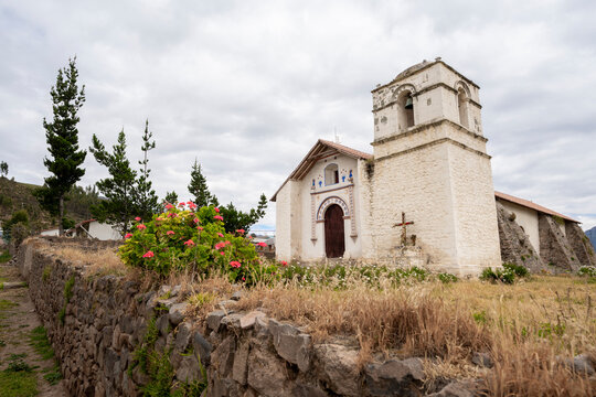 Traditional colonial sillar stone church with thatched roof in Pinchollo village, Colca Valley, Peru