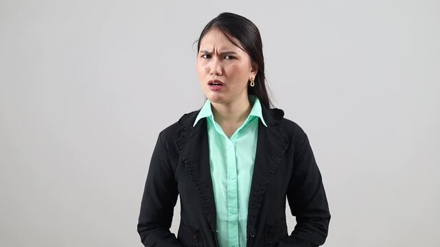 Portrait of Asian businesswoman in doubt, confusion and angry head shake in no gesture