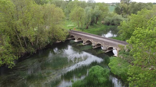 Aerial Drone Footage of Oakley Bridge Over River in Rural Bedfordshire Countryside, UK