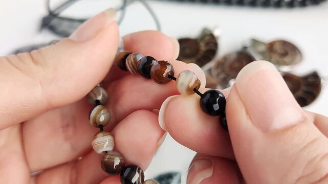 These assorted round agate beads showcase natural color variations and faceted finishes for sophisticated jewelry crafting and unique custom accessory design work