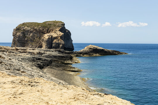 Fungus Rock and Limestone Coastline at Dwejra Bay, Gozo