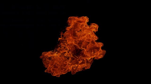 Small fire explosion with glowing sparks and embers isolated on a black background. Dynamic flames and combustion effects captured in high detail for dramatic visual impact.