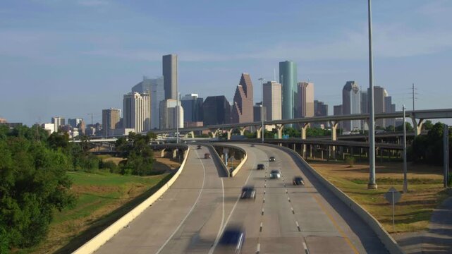 Motion time lapse of houston downtown skyline and traffic on freeway interstate 45.