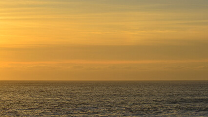 Obraz premium A serene sunset over the Atlantic Ocean in Baiona, on the Camino de Santiago.