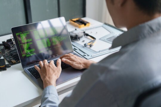 Asian programer using AI vibe coding on laptop