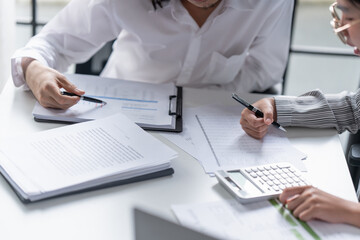Fototapeta premium Auditor or internal revenue service staff, Business women checking annual financial statements of company. Audit Concept.