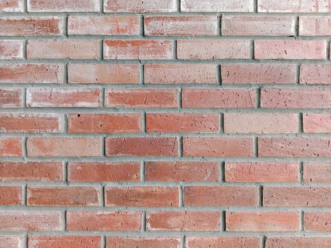 Contemporary brown brick wall displaying detailed texture and stylish appearance.