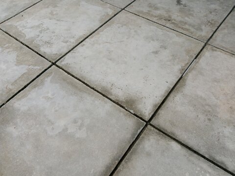Square concrete floor featuring natural cement texture with modern industrial appeal.