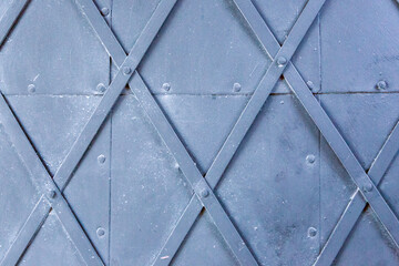 Obraz premium Metallic door with rhombus shape texture background