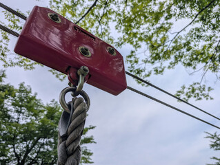 Close-up of a zip line pulley in a forest playground at Tokura Lake / 徳良湖の森の冒険、ジップラインの滑車パーツのクローズアップ © Chan_Heritage_Japan
