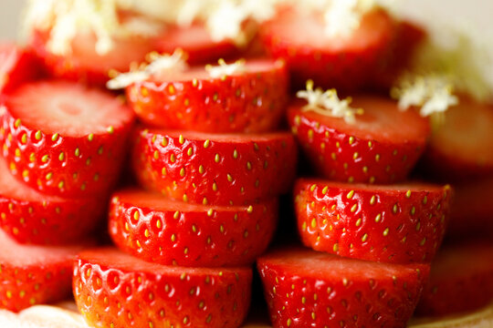 Cake topped with fresh strawberries.